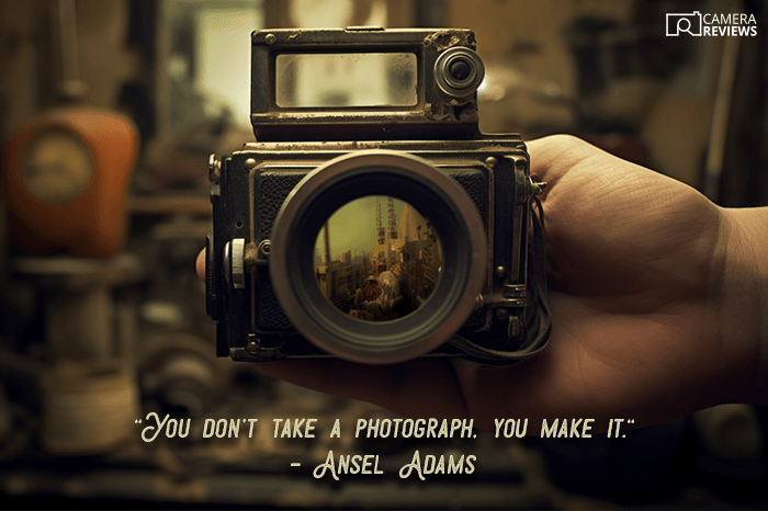 Ansel Adams photography quote overlayed on a photo of a person holding a camera