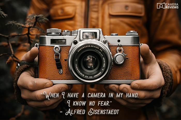 Photography quote overlayed on a photo of a person holding a camera